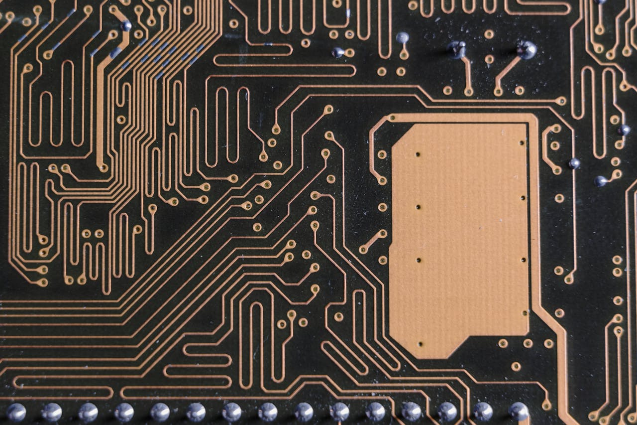 Home Detailed view of intricate circuit board patterns in technology hardware.